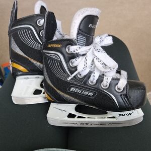 Bauer Kids Skates in Black, White, and Gold